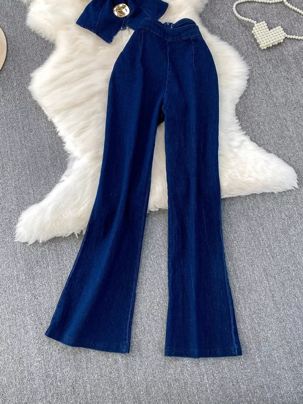 Dark blue cotton denim flare jeans with asymmetrical buttoned vest set.