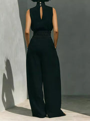 Black sleeveless turtleneck set with smocked waist and wide-leg pants