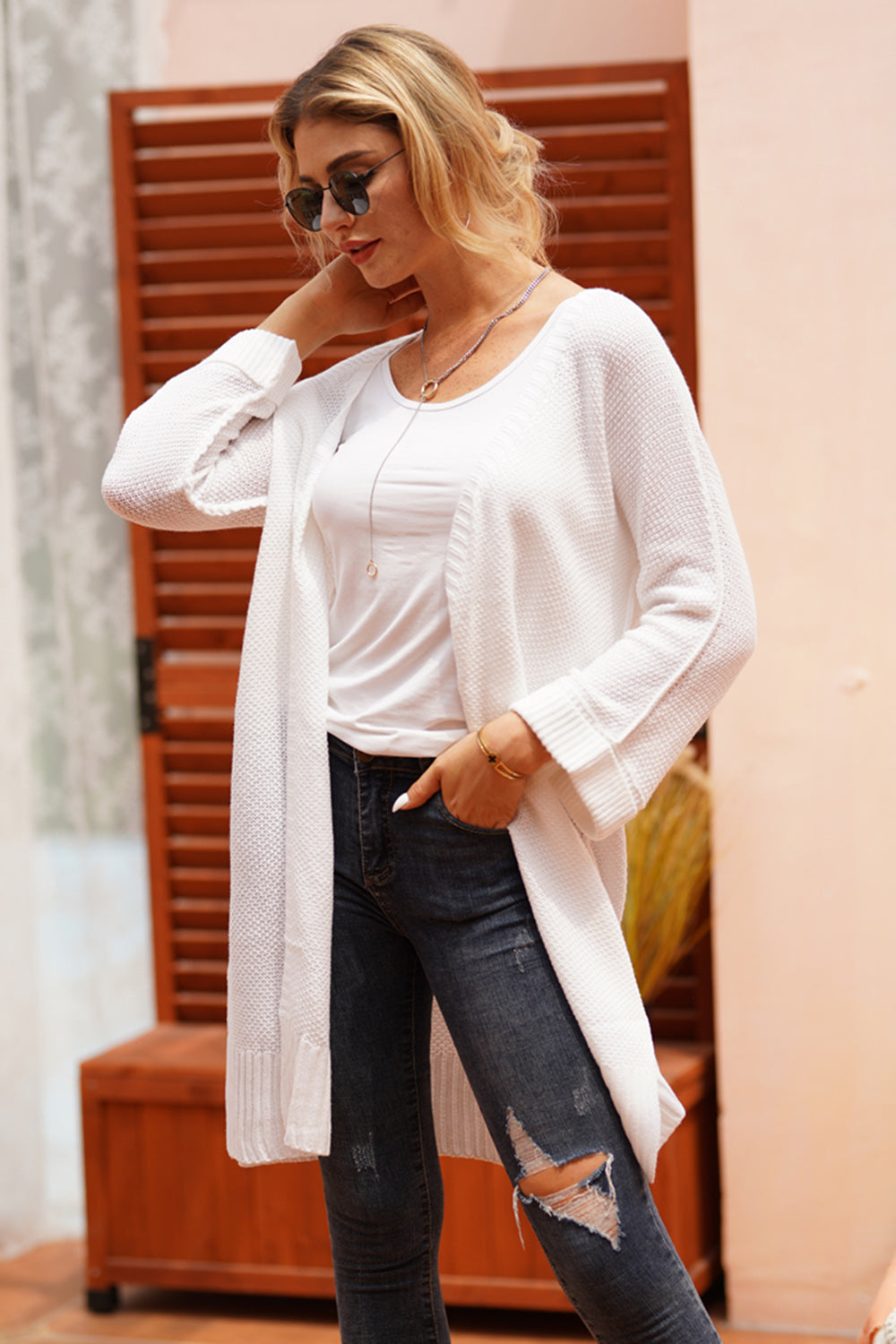White textured open-front maxi knit cardigan with a waffle knit pattern.