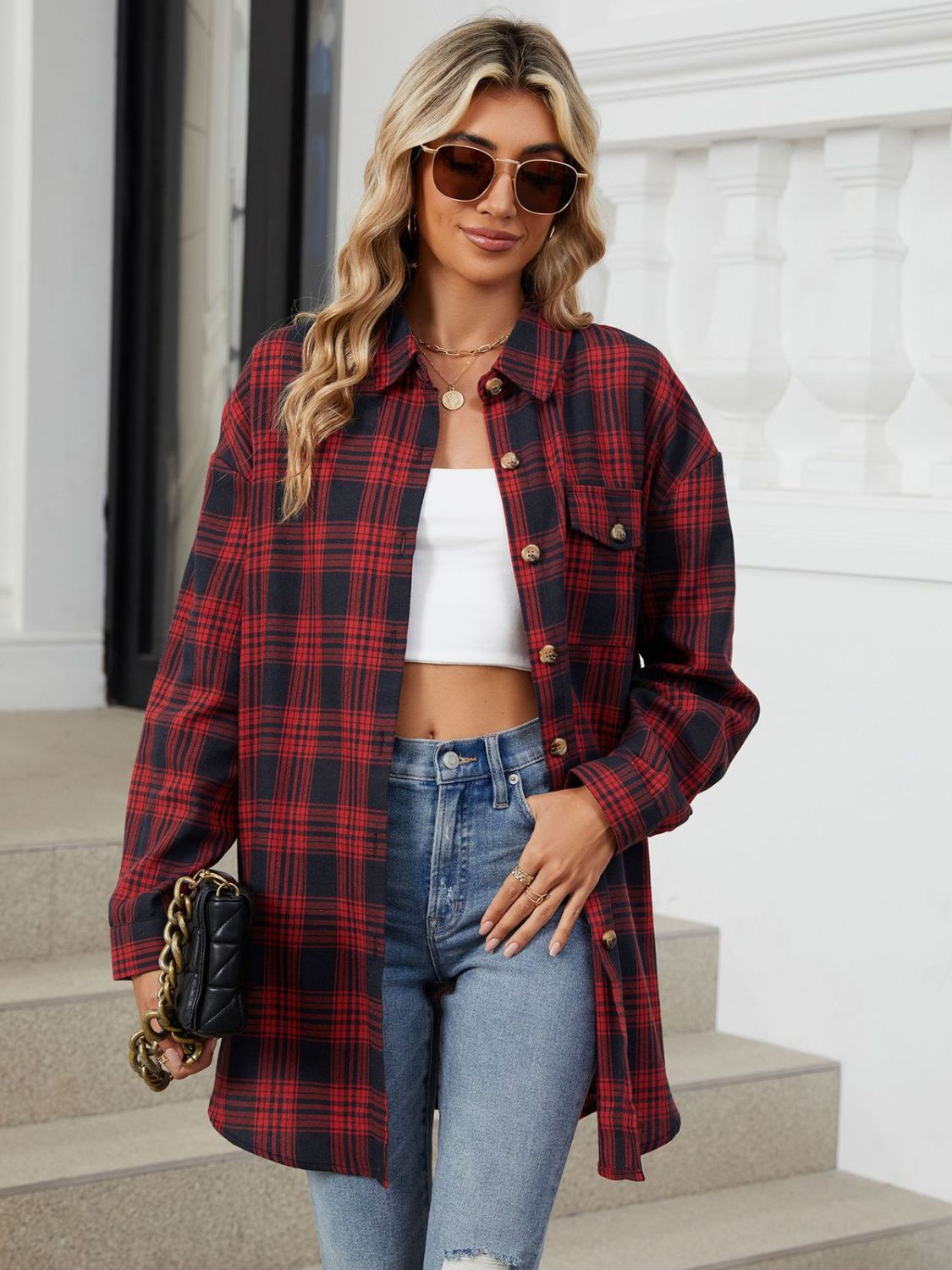 Oversized red and black plaid shacket with button front and chest pockets.