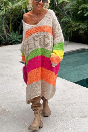 Beige knit midi sweater dress with rainbow stripes and "PEACE" lettering, V-neck, long sleeves.