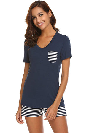 Dark blue V-neck lounge set with striped pocket and shorts.