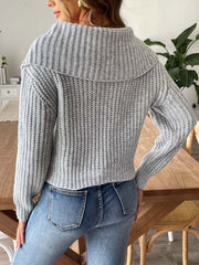 Gray ribbed knit sweater with a shawl collar and long sleeves.