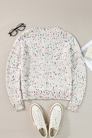 White confetti knit button-up cardigan with a crew neck and long sleeves.