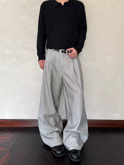 Relaxed wide-leg sweatpants in light grey with vertical pinstripes and a comfortable fit.