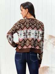 Geometric snowflake knit sweater in chestnut brown acrylic with a crew neck and long sleeves.