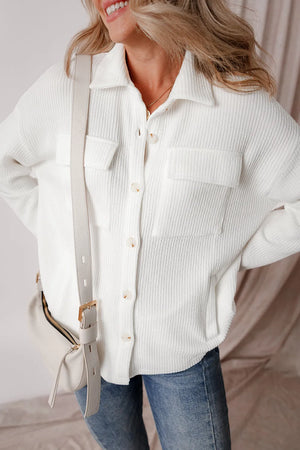 White textured corduroy overshirt with patch pockets and button front.