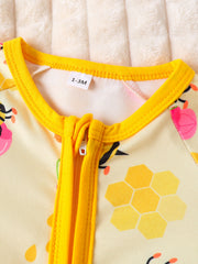 Yellow baby one-piece with bee and honeycomb print, yellow zipper and trim