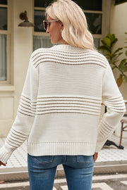 Cream open-knit mock neck sweater with horizontal openwork details and ribbed cuffs.