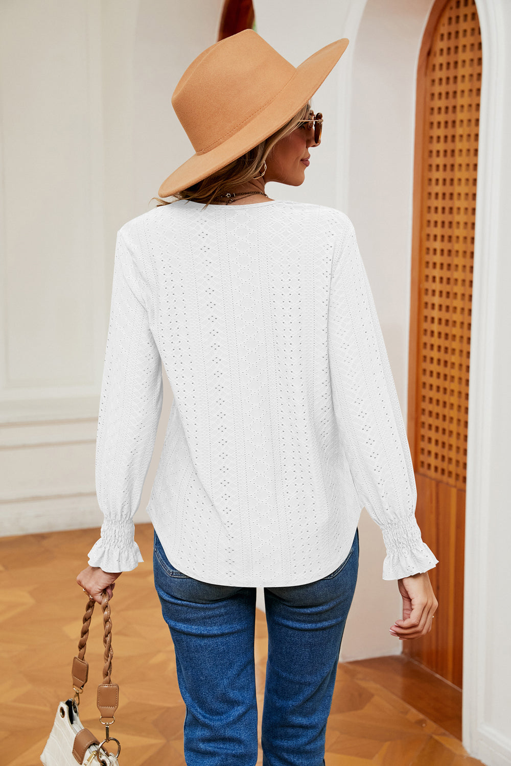 White eyelet blouse with lace trim and ruffle cuffs, long sleeves, v-neck