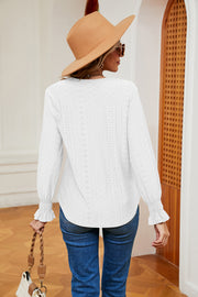 White eyelet blouse with lace trim and ruffle cuffs, long sleeves, v-neck