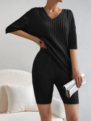 Black ribbed V-neck loungewear set with short sleeves and biker shorts.