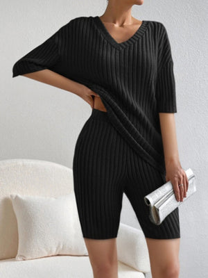 Black ribbed V-neck loungewear set with short sleeves and biker shorts.
