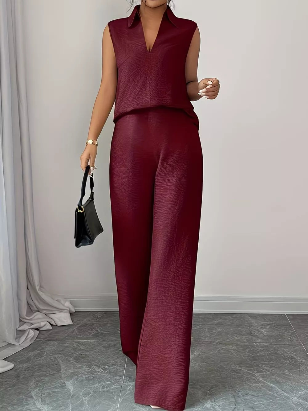 Burgundy sleeveless collared top and wide-leg pants set with textured fabric.