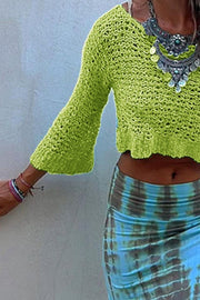 Lime crochet crop top with bell sleeves and a V-neck, styled with a tie-dye skirt.