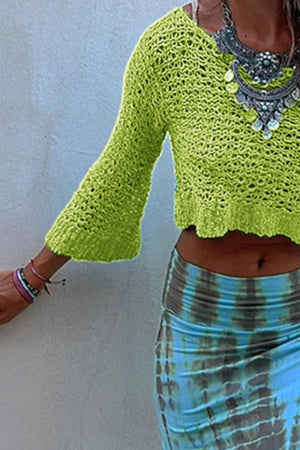 Lime crochet crop top with bell sleeves and a V-neck, styled with a tie-dye skirt.