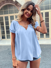 Light blue gathered sleeve blouse with plunge neckline, casual short sleeves