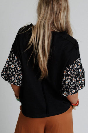 Black t-shirt with contrast daisy print sleeves and crew neck