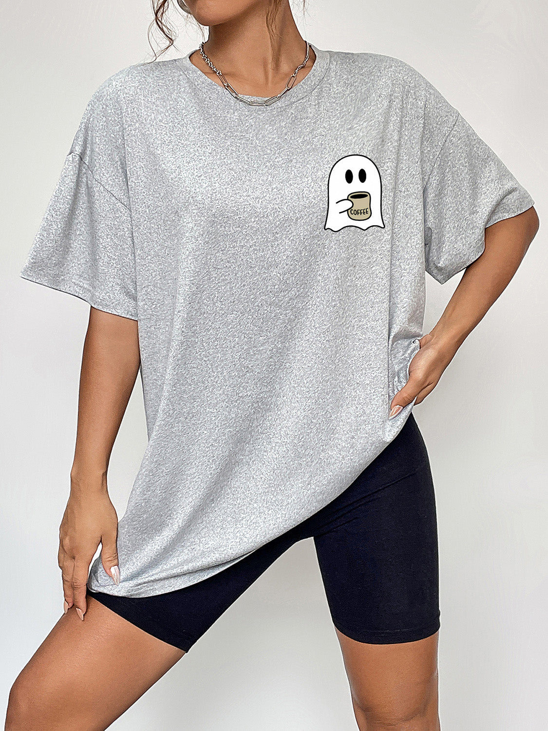 Grey graphic t-shirt with a coffee ghost design on the chest, crew neck, short sleeves.