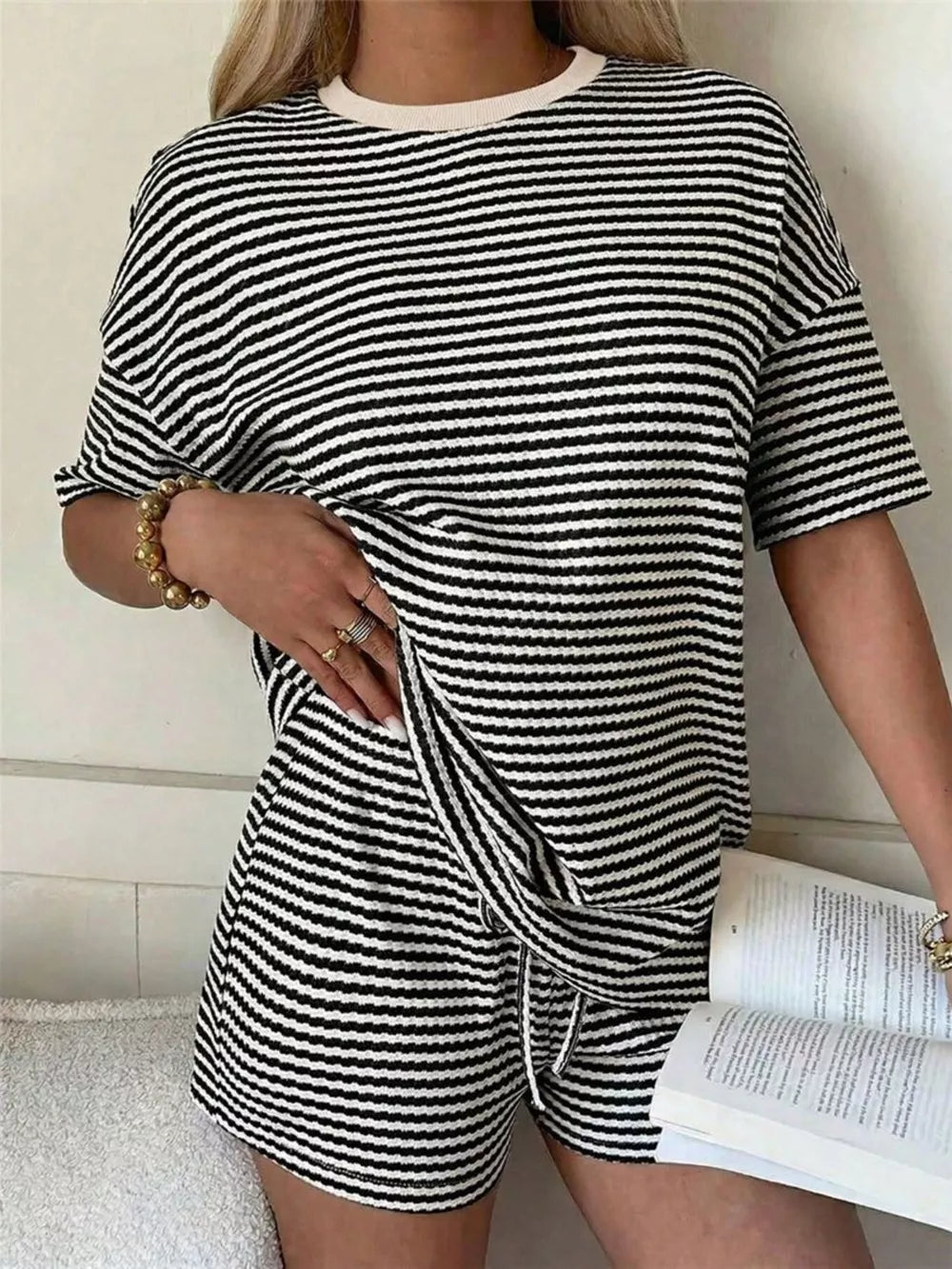 Black and white striped two-piece set with drawstring shorts and a crewneck tee.