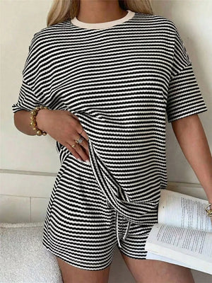 Black and white striped two-piece set with drawstring shorts and a crewneck tee.