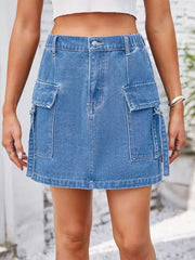 Denim cargo skirt in Dusty Blue with utility pockets and metal ring details.