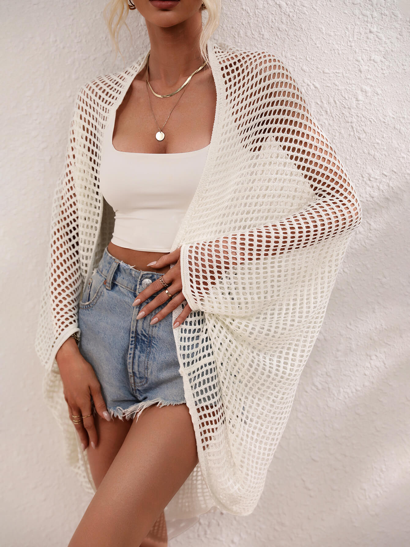 White open-weave kimono duster with batwing sleeves and a breathable acrylic knit.