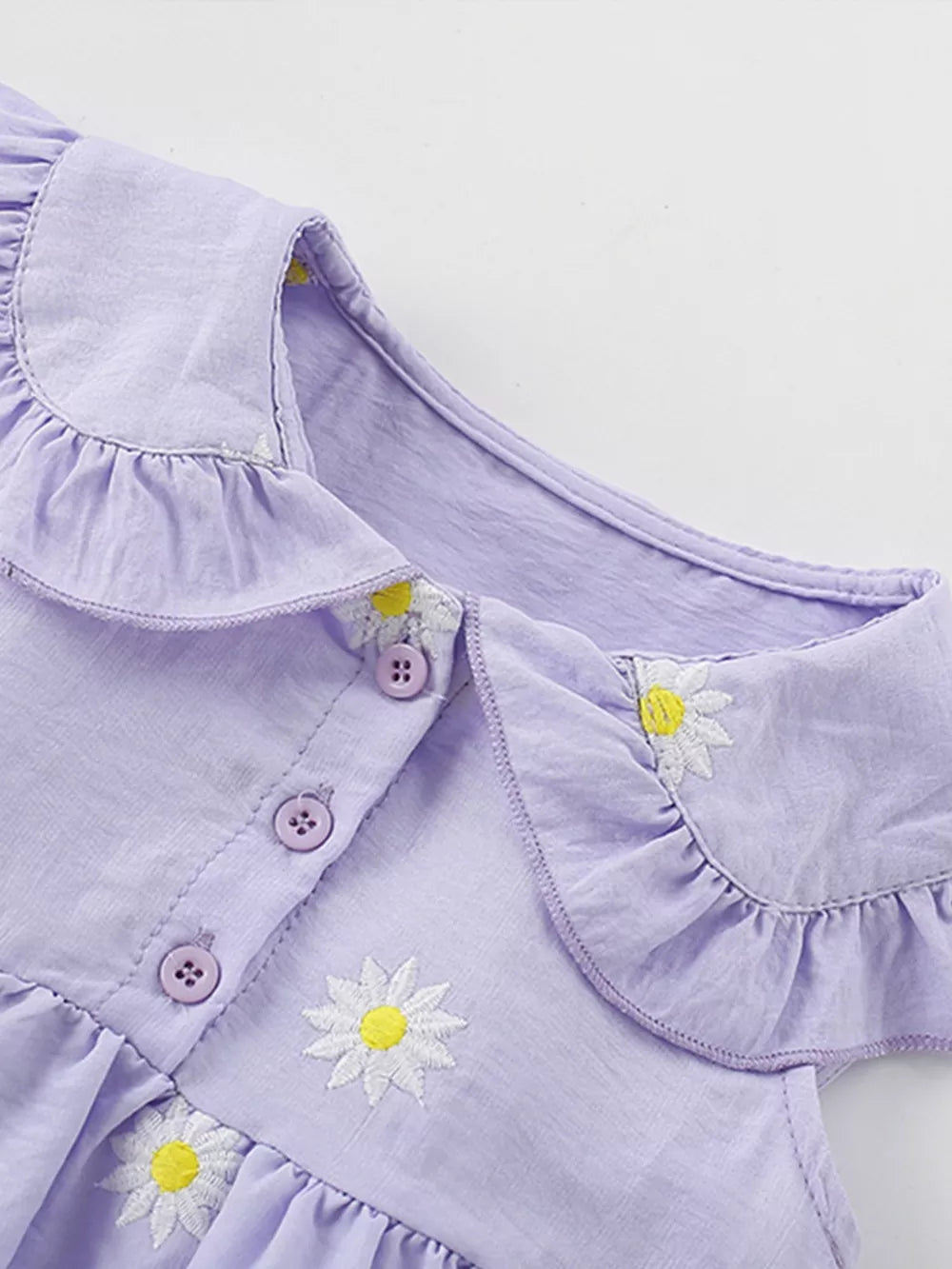 Lavender cotton dress with Peter Pan collar, daisy embroidery, and button front.