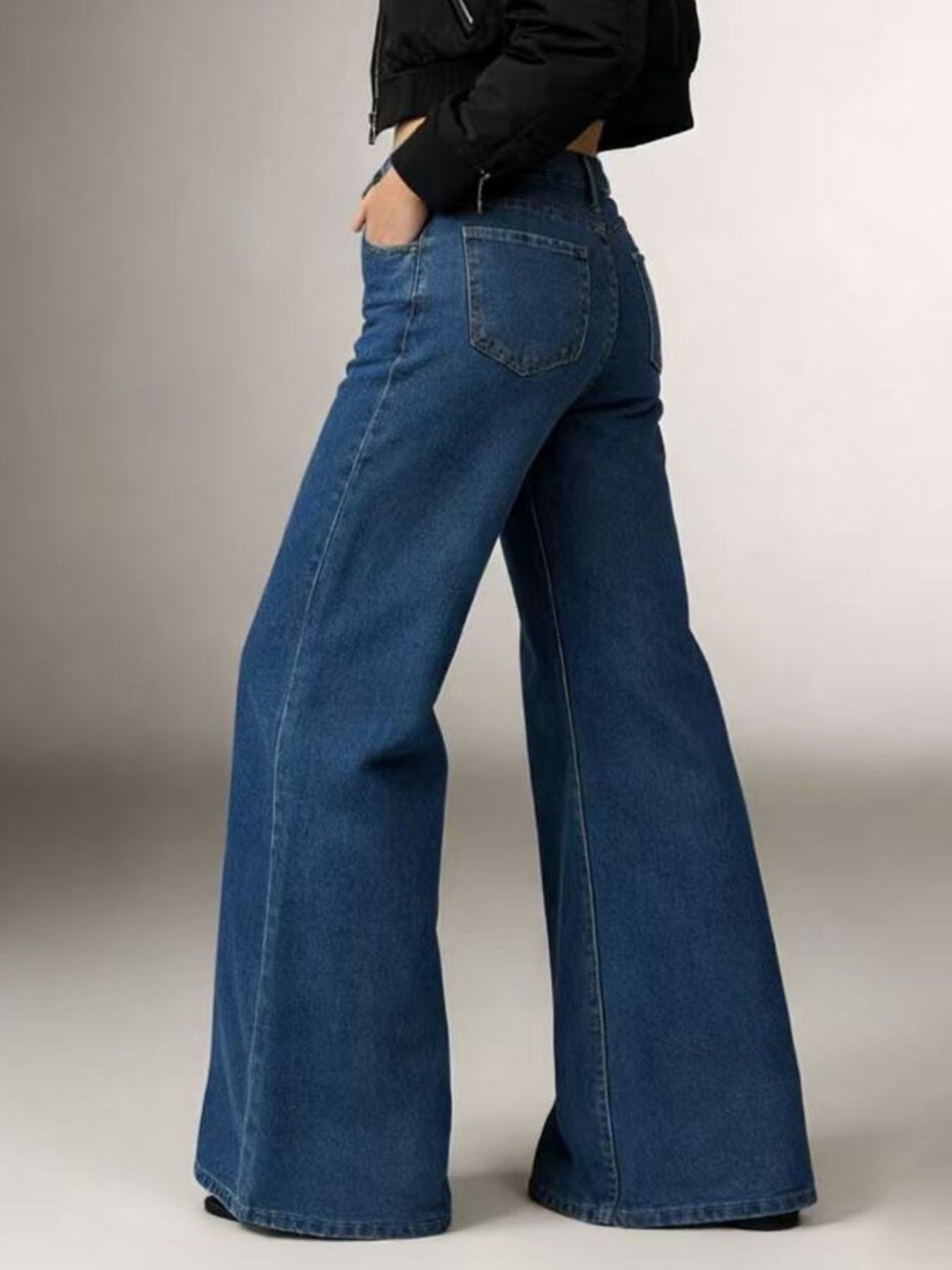 Maternity high-waisted flare jeans in blue denim with a wide leg.
