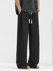 Men's black relaxed fit sweatpants with drawstring waist and pockets.