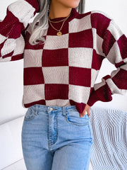Burgundy and cream checkerboard knit mock neck pullover sweater with open knit detail.