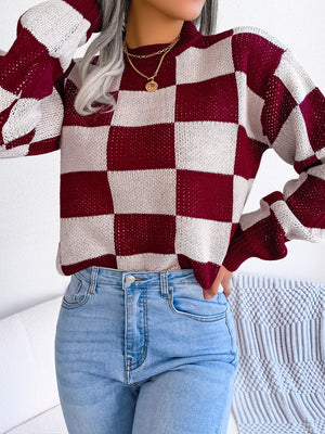 Burgundy and cream checkerboard knit mock neck pullover sweater with open knit detail.