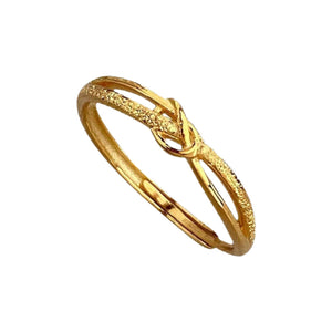 Gold knot ring with textured band detail