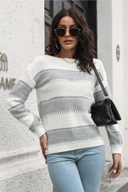 Perforated stripe knit sweater in white and light gray with off-shoulder neckline.