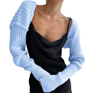Misty Blue ribbed knit shrug with extended sleeves, worn over a black slip dress.