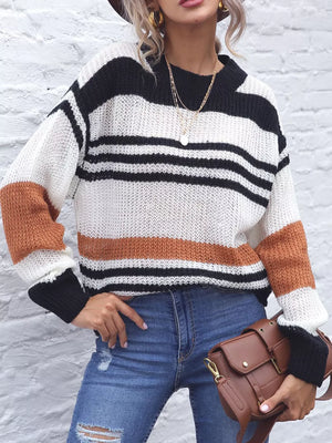 Casual striped knit sweater with color block accents in black, white, and beige acrylic.