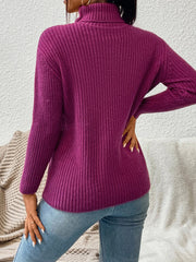 Textured ribbed turtleneck sweater in red-violet, featuring a cozy knit and long sleeves.