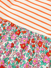 Baby dress with orange stripes and a floral print skirt