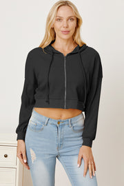 Black waffle knit cropped zip hoodie with drawstring hood and elastic hem.