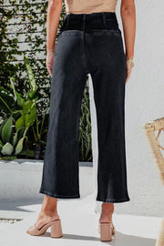 Black button-front cropped wide-leg jeans with a high waist.