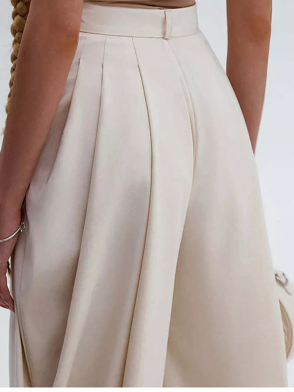 High-waisted Pleated Drape Pants in Black, model styling view