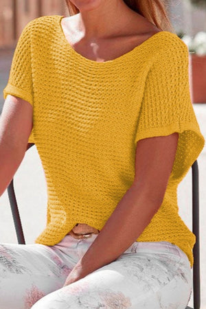 Gold open-knit dolman sleeve top with a boat neckline and textured pattern.