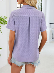 Lavender eyelet polo collar blouse with short sleeves and a back pleat detail.