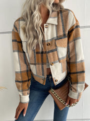Checked plaid shacket with patch pockets in brown, cream, and black. Button front, collared, long sleeve.