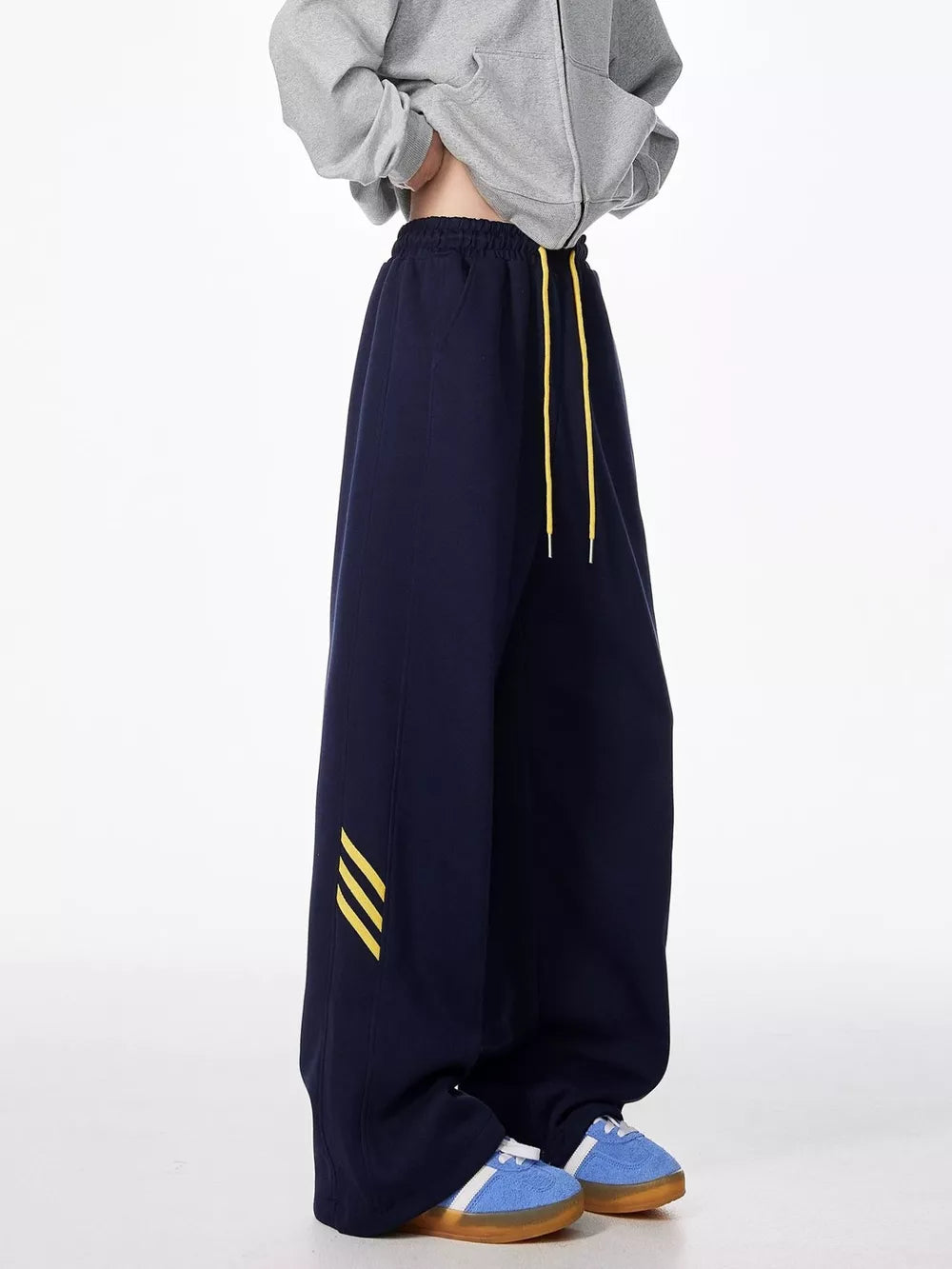 Dark Navy relaxed fit sweatpants with yellow drawstring and stripe detail.