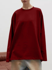Burgundy oversized crewneck sweatshirt with voluminous long sleeves and a relaxed fit.