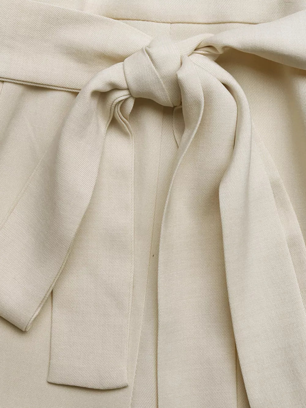 Cream belted maternity romper with a tie waist detail