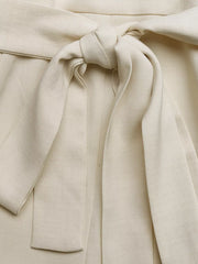Cream belted maternity romper with a tie waist detail