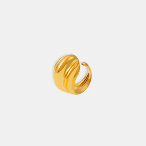 Sculpted gold ridge ring with a textured, wavy design.