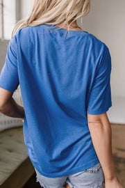 Blue oversized graphic t-shirt with short sleeves and a crew neck, shown from the back.